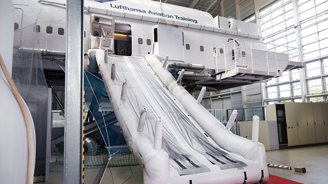 A Cabin Emergency Evacuation Trainer (CEET) with rescue chute in a training centre