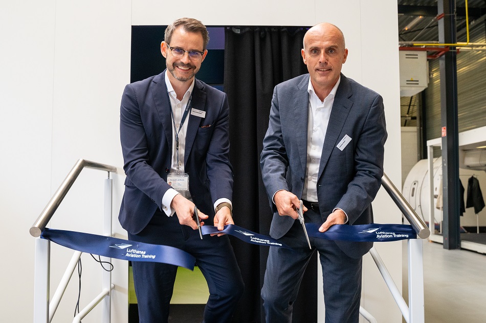 Two people at the ribbon-cutting ceremony for Brussels.