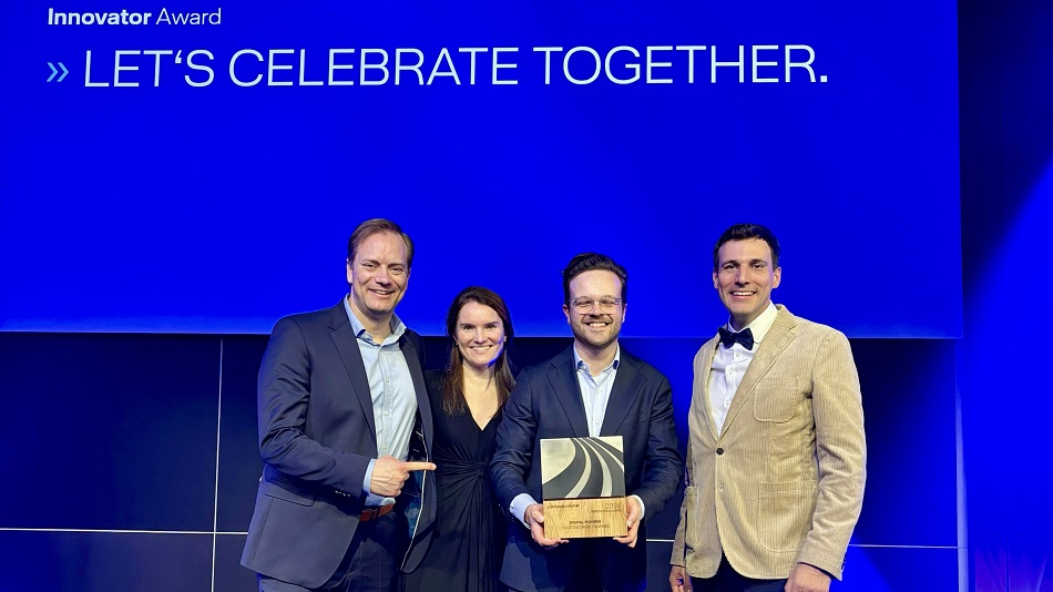 Four people holding the LH Group Innovator Award.
